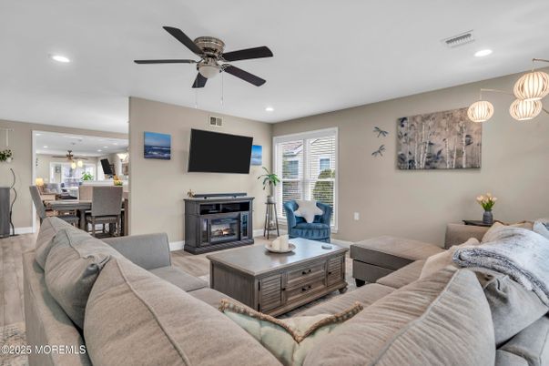Dining room, Fireplace, Interior, Living room, Pendant Lights, Recessed Lighting, Wood Texture Flooring