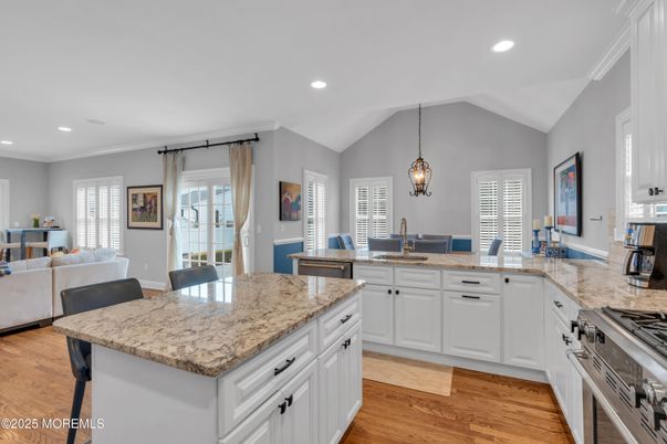 Dining room, Interior, Kitchen, Pendant Lights, Recessed Lighting, Stainless Steel Appliances, Wood Texture Flooring