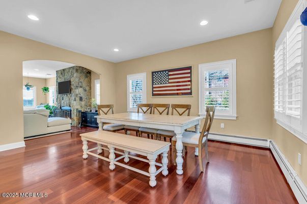 Dining room, Fireplace, Interior, Living room, Pendant Lights, Recessed Lighting, Stone Walls, Wood Texture Flooring