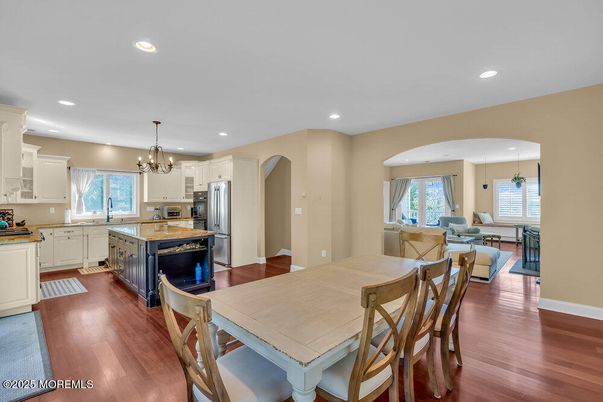 Chandelier, Dining room, Interior, Kitchen, Living room, Recessed Lighting, Stainless Steel Appliances, Wood Texture Flooring