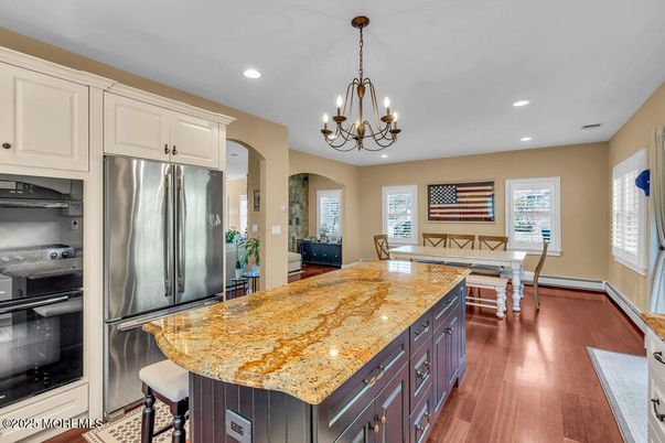 Chandelier, Dining room, Interior, Kitchen, Recessed Lighting, Stainless Steel Appliances, Wood Texture Flooring