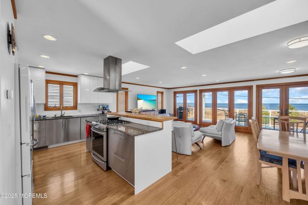 Dining room, Interior, Kitchen, Living room, Recessed Lighting, Water, Wood Texture Flooring