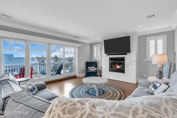 Fireplace, Interior, Living room, Recessed Lighting, Water, Wood Texture Flooring