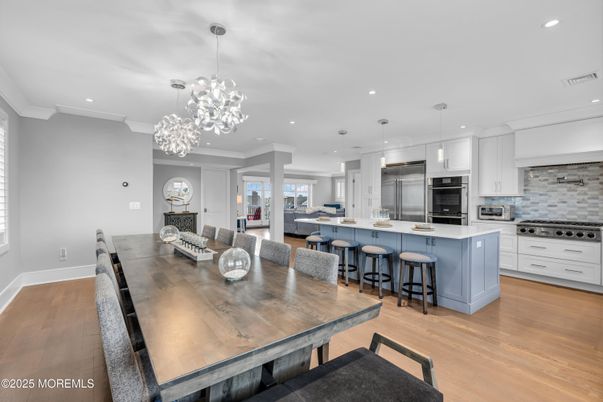 Dining room, Interior, Kitchen, Pendant Lights, Recessed Lighting, Stainless Steel Appliances, Wood Texture Flooring