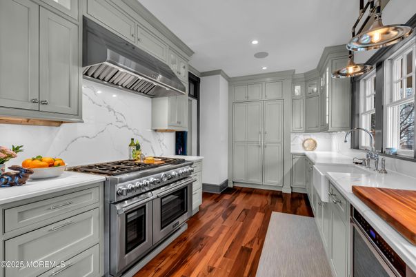 Interior, Kitchen, Marble Walls, Pendant Lights, Recessed Lighting, Stainless Steel Appliances, Wood Texture Flooring