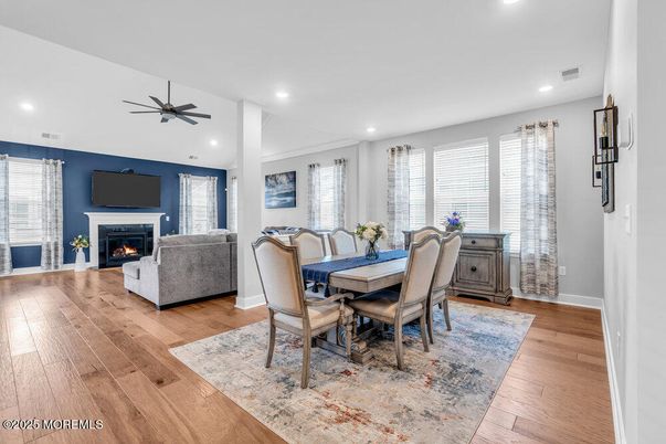 Dining room, Fireplace, Interior, Living room, Recessed Lighting, Wood Texture Flooring