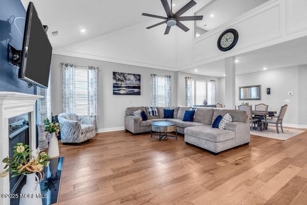 Dining room, Fireplace, Interior, Living room, Recessed Lighting, Wood Texture Flooring
