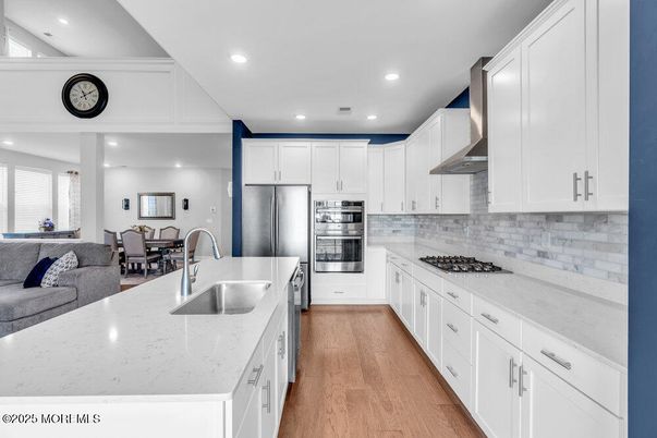 Dining room, Interior, Kitchen, Recessed Lighting, Stainless Steel Appliances, Wood Texture Flooring
