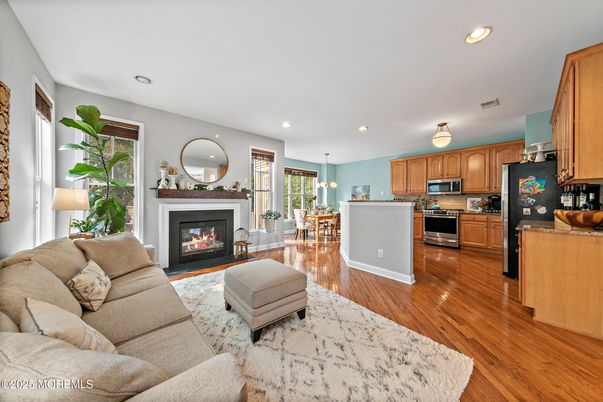 Dining room, Fireplace, Interior, Kitchen, Living room, Pendant Lights, Recessed Lighting, Stainless Steel Appliances, Wood Texture Flooring