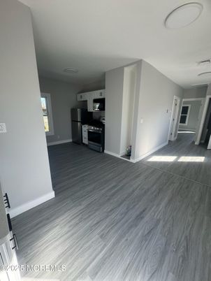 Empty room, Interior, Kitchen, Stainless Steel Appliances, Wood Texture Flooring