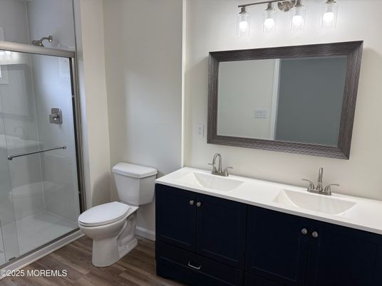 Bathroom, Dual Sink Vanities, Glass Shower, Interior, Wood Texture Flooring
