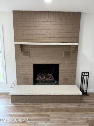 Fireplace, Interior, Recessed Lighting, Stone Walls, Wood Texture Flooring