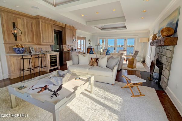 Dining room, Fireplace, Interior, Kitchen, Living room, Recessed Lighting, Water, Wood Texture Flooring