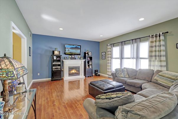 Fireplace, Interior, Living room, Recessed Lighting, Wood Texture Flooring