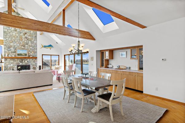 Chandelier, Dining room, Fireplace, Interior, Living room, Stone Walls, Wooden Beams, Wood Texture Flooring
