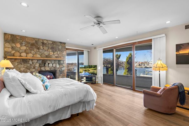 Bedroom, Fireplace, Interior, Recessed Lighting, Stone Walls, Wood Texture Flooring