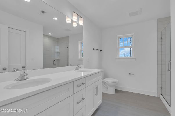 Bathroom, Dual Sink Vanities, Glass Shower, Interior, Recessed Lighting, Wood Texture Flooring