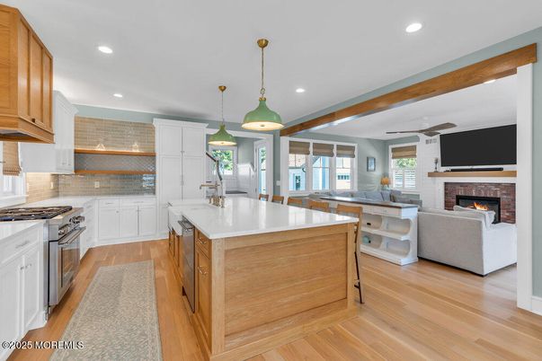 Fireplace, Interior, Kitchen, Pendant Lights, Recessed Lighting, Stainless Steel Appliances, Wood Texture Flooring
