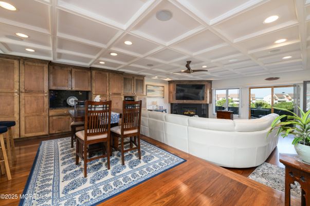Dining room, Fireplace, Interior, Living room, Recessed Lighting, Wood Texture Flooring