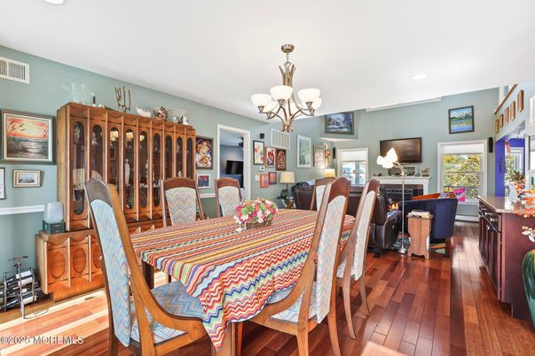 Chandelier, Dining room, Fireplace, Interior, Living room, Recessed Lighting, Wood Texture Flooring