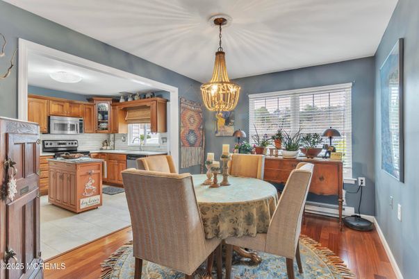 Chandelier, Dining room, Interior, Kitchen, Stainless Steel Appliances, Wood Texture Flooring