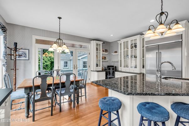 Chandelier, Dining room, Interior, Kitchen, Pendant Lights, Recessed Lighting, Stainless Steel Appliances, Wood Texture Flooring