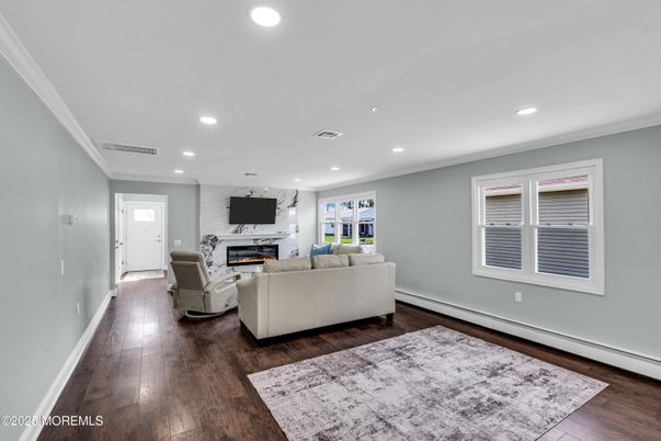 Fireplace, Interior, Living room, Marble Walls, Recessed Lighting, Wood Texture Flooring