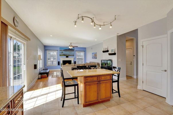 Dining room, Fireplace, Interior, Kitchen, Living room, Recessed Lighting, Wood Texture Flooring