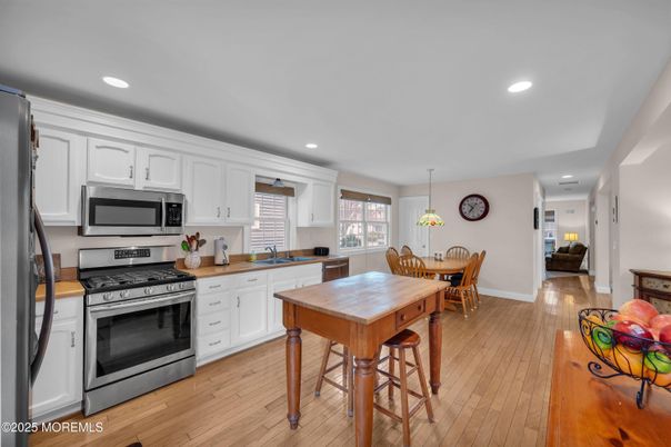 Dining room, Interior, Kitchen, Pendant Lights, Recessed Lighting, Stainless Steel Appliances, Wood Texture Flooring
