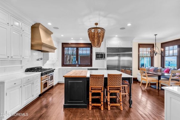 Chandelier, Dining room, Interior, Kitchen, Pendant Lights, Recessed Lighting, Stainless Steel Appliances, Wood Texture Flooring