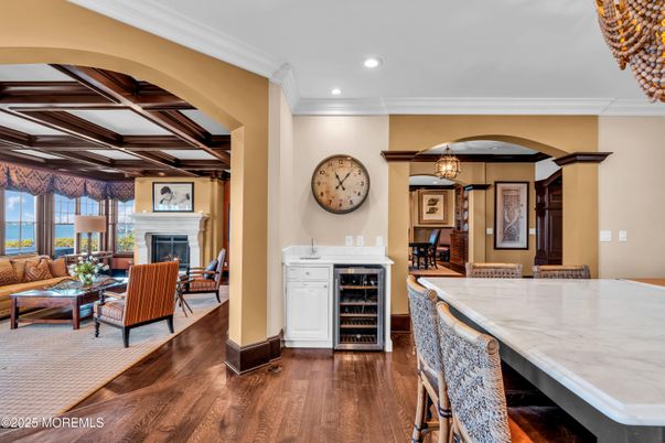 Dining room, Fireplace, Interior, Living room, Pendant Lights, Recessed Lighting, Wood Texture Flooring