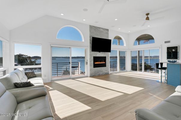Fireplace, Interior, Living room, Recessed Lighting, Water, Wood Texture Flooring