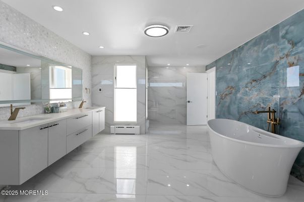 Bathroom, Dual Sink Vanities, Free Standing Baths, Interior, Marble, Marble Walls, Recessed Lighting