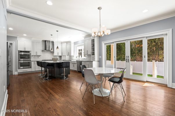 Chandelier, Dining room, Interior, Kitchen, Pendant Lights, Recessed Lighting, Stainless Steel Appliances, Wood Texture Flooring