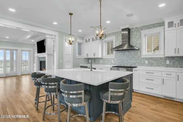 Fireplace, Interior, Kitchen, Pendant Lights, Recessed Lighting, Stainless Steel Appliances, Wood Texture Flooring