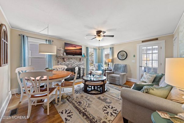 Dining room, Fireplace, Interior, Living room, Pendant Lights, Stone Walls, Wood Texture Flooring