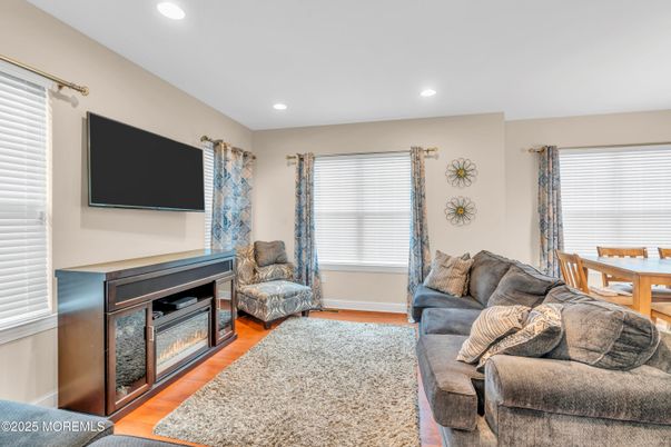 Dining room, Fireplace, Interior, Living room, Recessed Lighting, Wood Texture Flooring