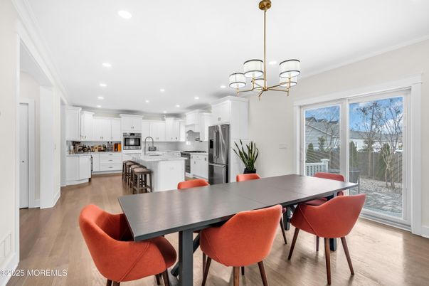 Chandelier, Dining room, Interior, Kitchen, Pendant Lights, Recessed Lighting, Stainless Steel Appliances, Wood Texture Flooring