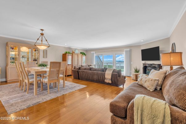 Dining room, Fireplace, Interior, Living room, Pendant Lights, Recessed Lighting, Wood Texture Flooring