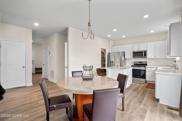 Dining room, Interior, Kitchen, Pendant Lights, Recessed Lighting, Stainless Steel Appliances, Wood Texture Flooring
