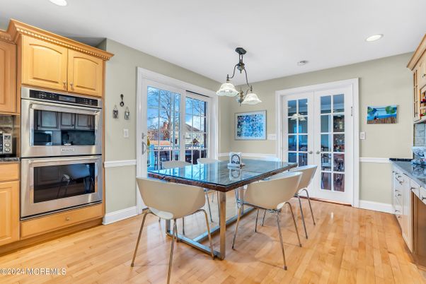 Dining room, Interior, Kitchen, Pendant Lights, Recessed Lighting, Stainless Steel Appliances, Wood Texture Flooring