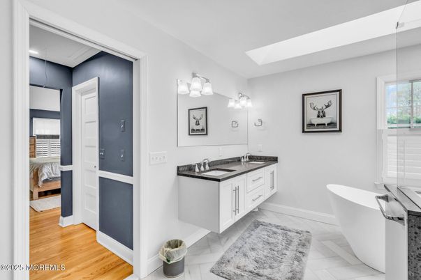 Bathroom, Dual Sink Vanities, Free Standing Baths, Interior, Marble, Wood Texture Flooring