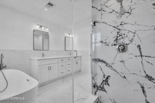 Bathroom, Dual Sink Vanities, Glass Shower, Interior, Marble, Marble Walls, Recessed Lighting