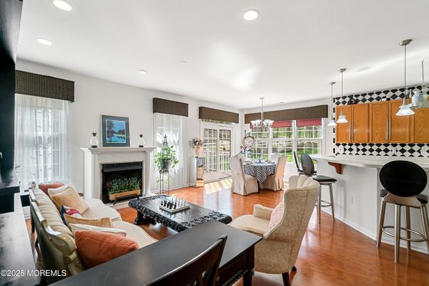 Dining room, Fireplace, Interior, Living room, Pendant Lights, Recessed Lighting, Wood Texture Flooring