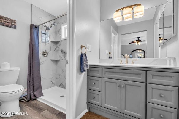 Bathroom, Glass Shower, Interior, Marble Walls, Wood Texture Flooring