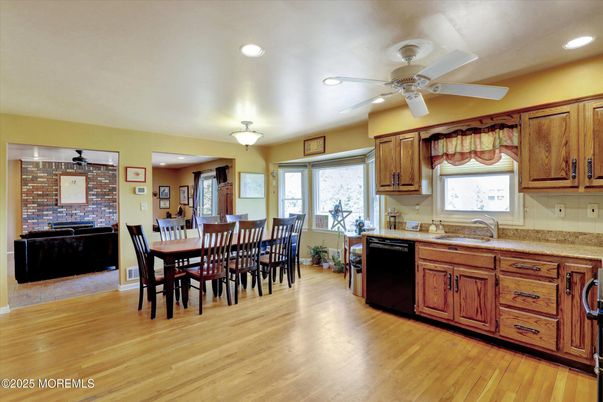 Dining room, Fireplace, Interior, Kitchen, Recessed Lighting, Stone Walls, Wood Texture Flooring