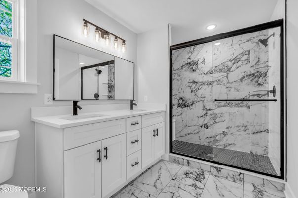 Bathroom, Dual Sink Vanities, Glass Shower, Interior, Marble, Marble Walls, Recessed Lighting