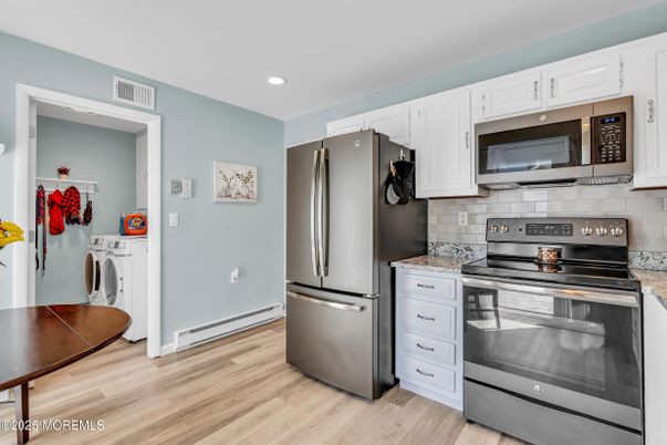 Interior, Kitchen, Recessed Lighting, Stainless Steel Appliances, Washer, Wood Texture Flooring