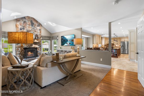 Fireplace, Interior, Kitchen, Living room, Recessed Lighting, Stainless Steel Appliances, Stone Walls, Wood Texture Flooring