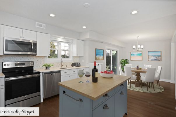 Chandelier, Dining room, Interior, Kitchen, Recessed Lighting, Stainless Steel Appliances, Wood Texture Flooring